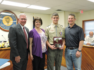 Aston Commissioner Mark Osborn presented Eagle Scout Darren Sereikis with a proclamation during a recent meeting of the board of commissioners. Also pictured are Darren's mother, Cindy; and father Michael.