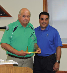 Aston Commissioners President Jim Stigale presented nine-term commissioner Jim McGinn with a service award for his dedication to the township.   Photo by Loretta Rodgers