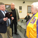 With Aston Commissioner Jim McGinn looking on, Police Chief Dan Ruggieri presented a plaque of gratitude to Harriet Reynolds, president of the Aston Lioness Club.  Photo by Loretta Rodgers