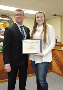 Aston 1st Ward Commissioner Michael Link presented Sun Valley High School basketball player Kate Lannon with a certificate of achievement in recognition of Lannon's scoring 1,000 points. Photo by Loretta Rodgers